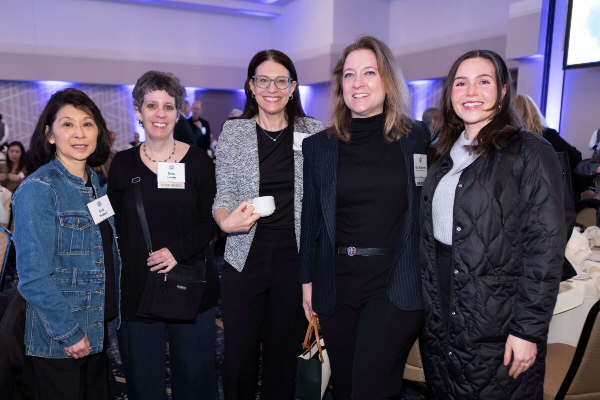 Five smiling women at the KCSARC BE LOUD Breakfast