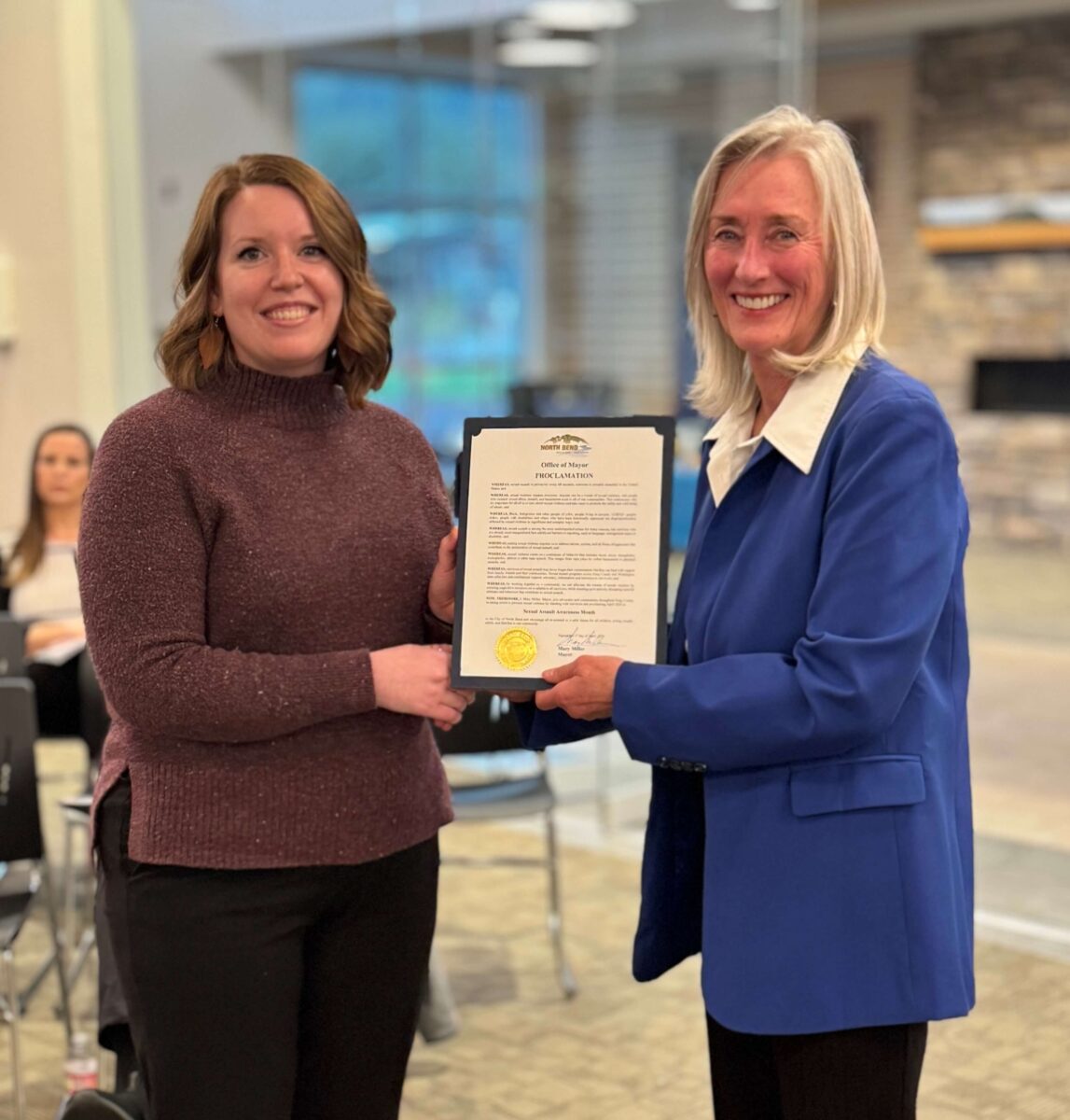 KCSARC staff member accepts a Sexual Assault Awareness Month Proclamation from the city of North Bend.