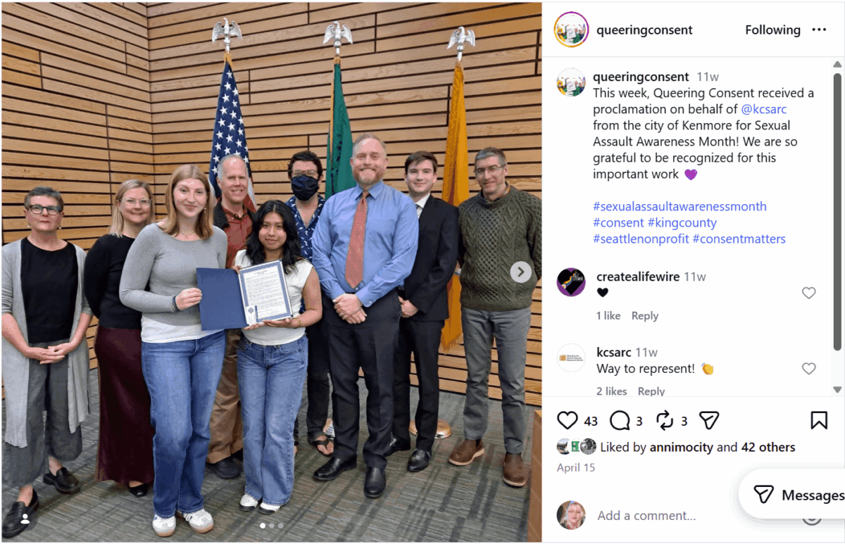Social media post from Queering Consent account showing a group of people posing with two young people holding a Sexual Assault Awareness Month proclamation.