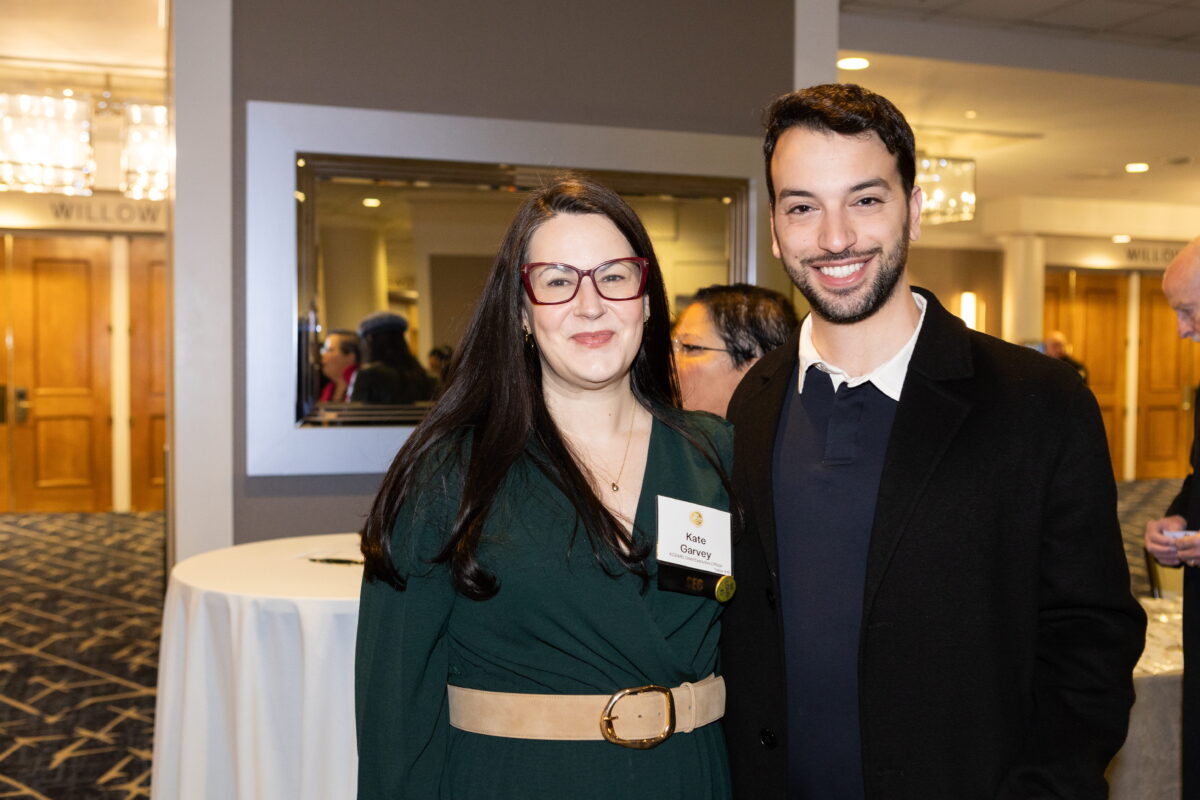 KCSARC CEO and board member smile and post at KCSARC fundraising event.