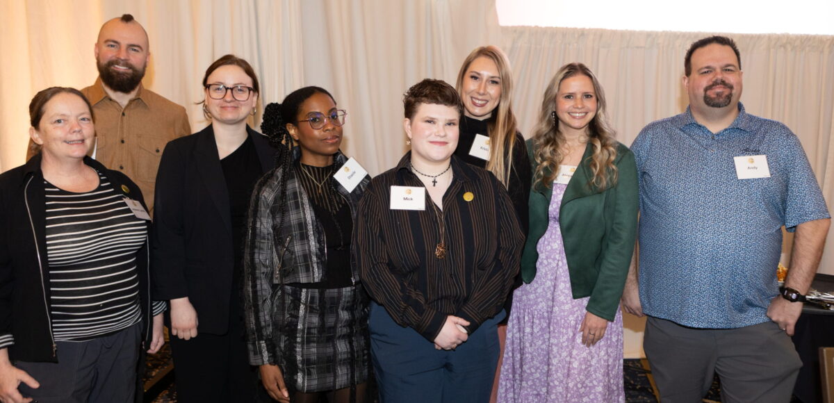 Empowered Voices group smiles and poses at 2026 BE LOUD Breakfast.