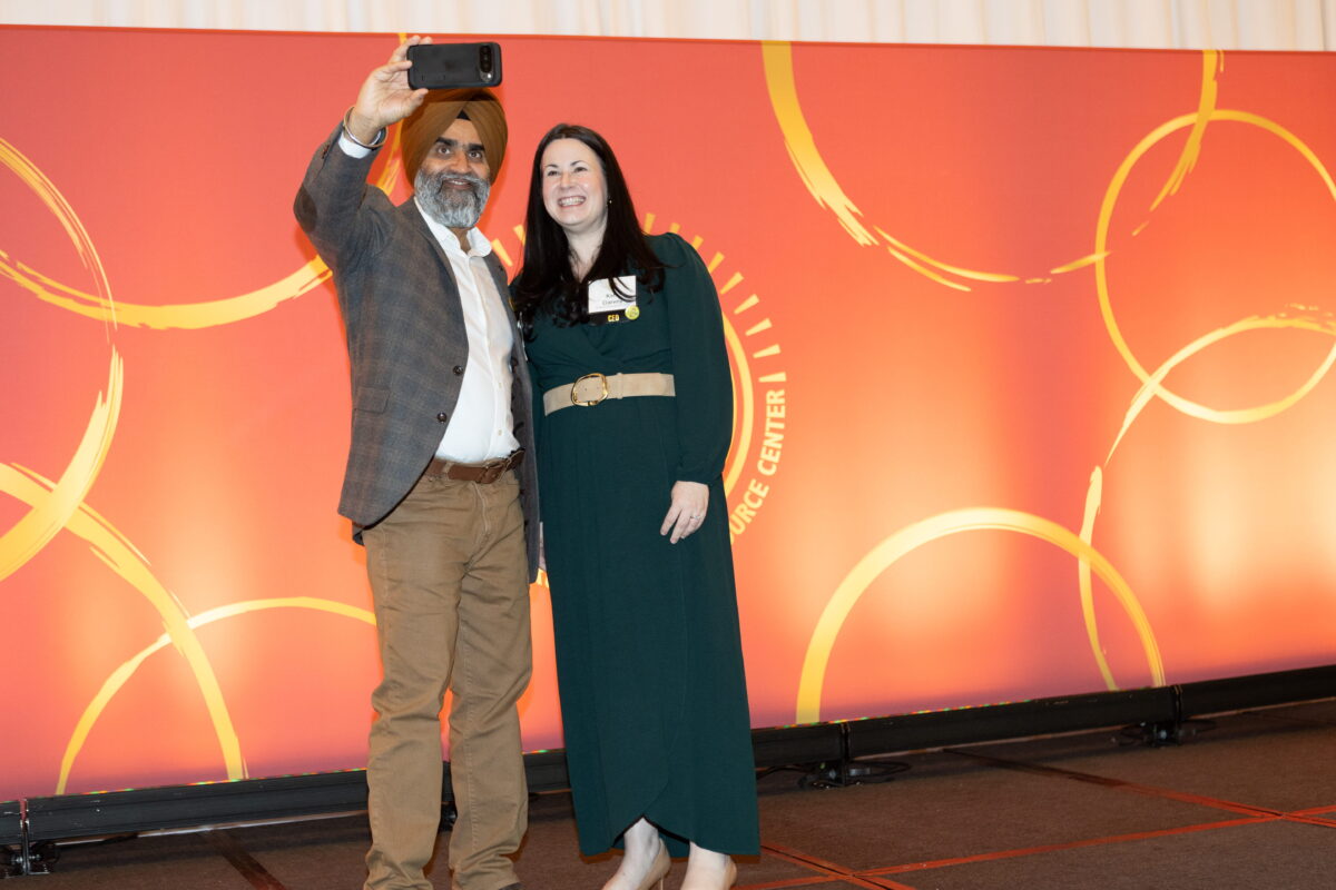 KCSARC CEO and board member take a selfie at 2026 BE LOUD Breakfast event.